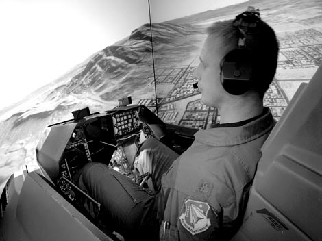 Air Force pilot at the Air Force Research Laboratory located at Williams AFB flies an F-16 simulator over Nellis AFB.