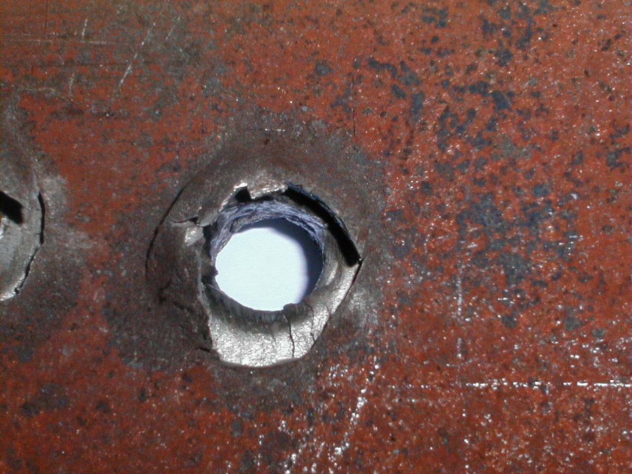 Rear face of HV 295 plate showing evidence of spalling.