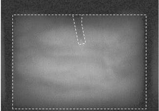 Aluminium backing faced with silicon carbide showing the outline of the penetrator path, the FFV penetrator having been completely eroded.