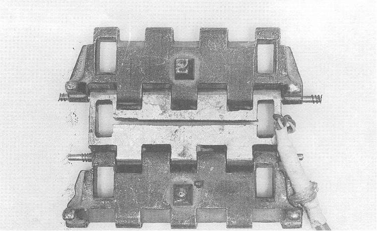 The instrumented track link for the one-tenth scale models.