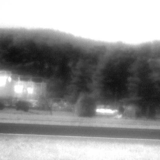 Background scene showing blurring due to turbulence after passage of aircraft.