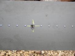 Visual image of FSJA specimen following ballistic impact damage at an incident bullet angle of 60° with respect to the centre rivet axis as presented in Figure 5.