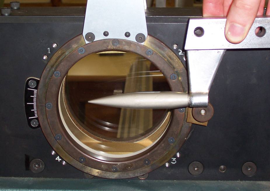 Projectile holder (using a sting) and mounting block.