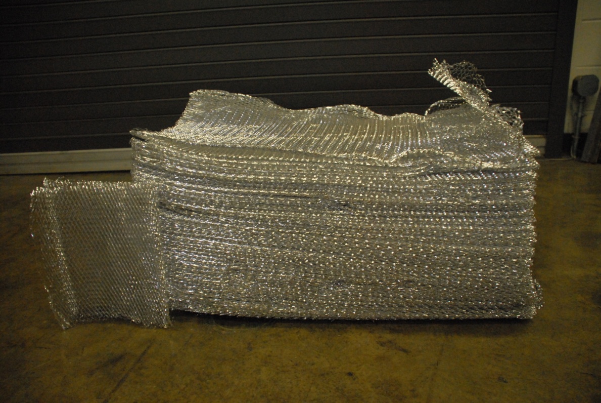 A stack of aluminium mesh samples.