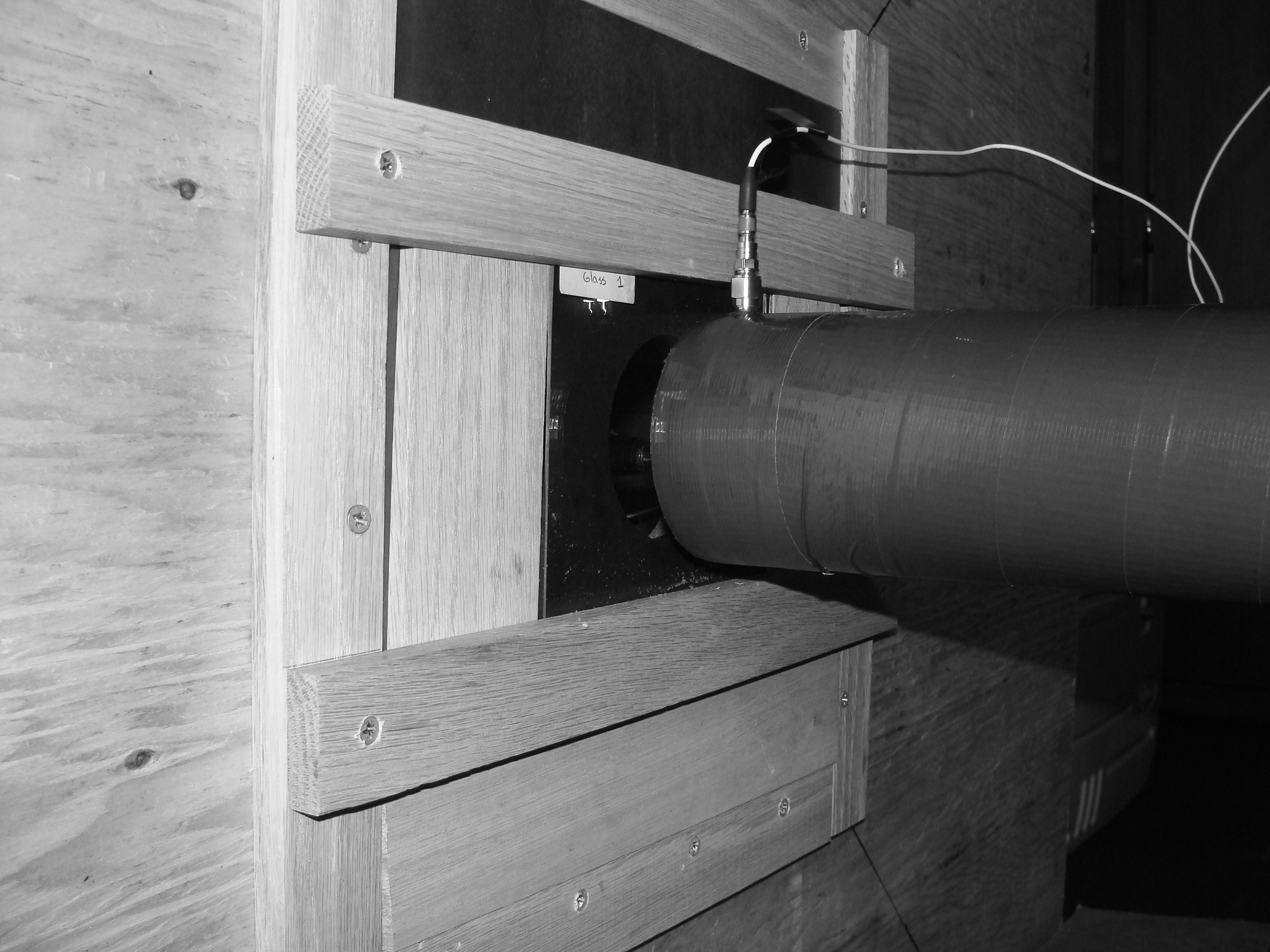 Each sample was mounted on a steel plate (in the wooden frame) with a hole in the centre to prevent influence on the pressure measurements by part of the blast wave that might have diffracted around the samples instead of transmitting through them.