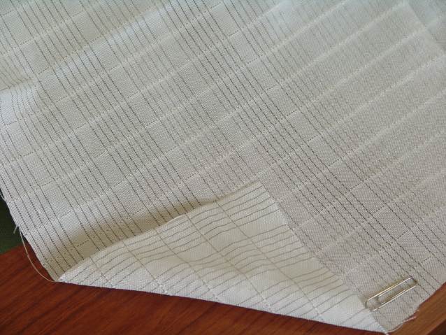 Image of prototype transmission lines in the warp and weft of a weaved textile.