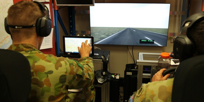Physical arrangement of the vehicle simulator. Participant performing the C2 tasks is seated on the left.